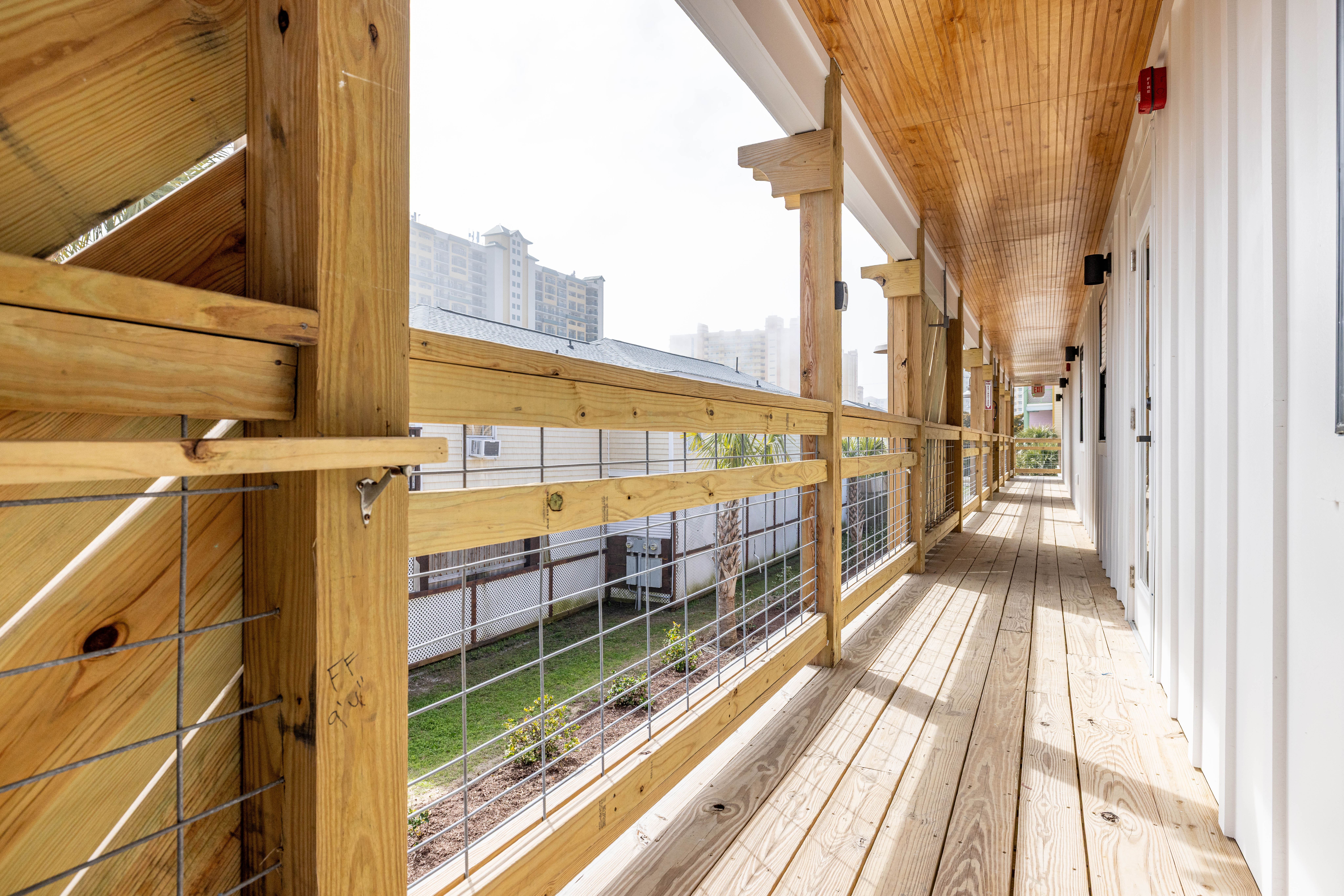 New second-floor balconies with railing at motel