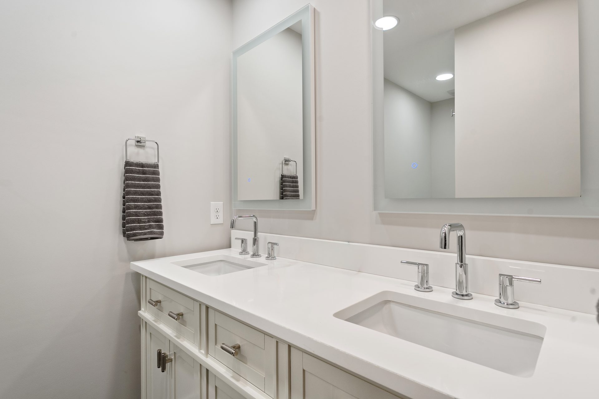Renovated bathroom with double vanity and quartz countertop in North Myrtle Beach