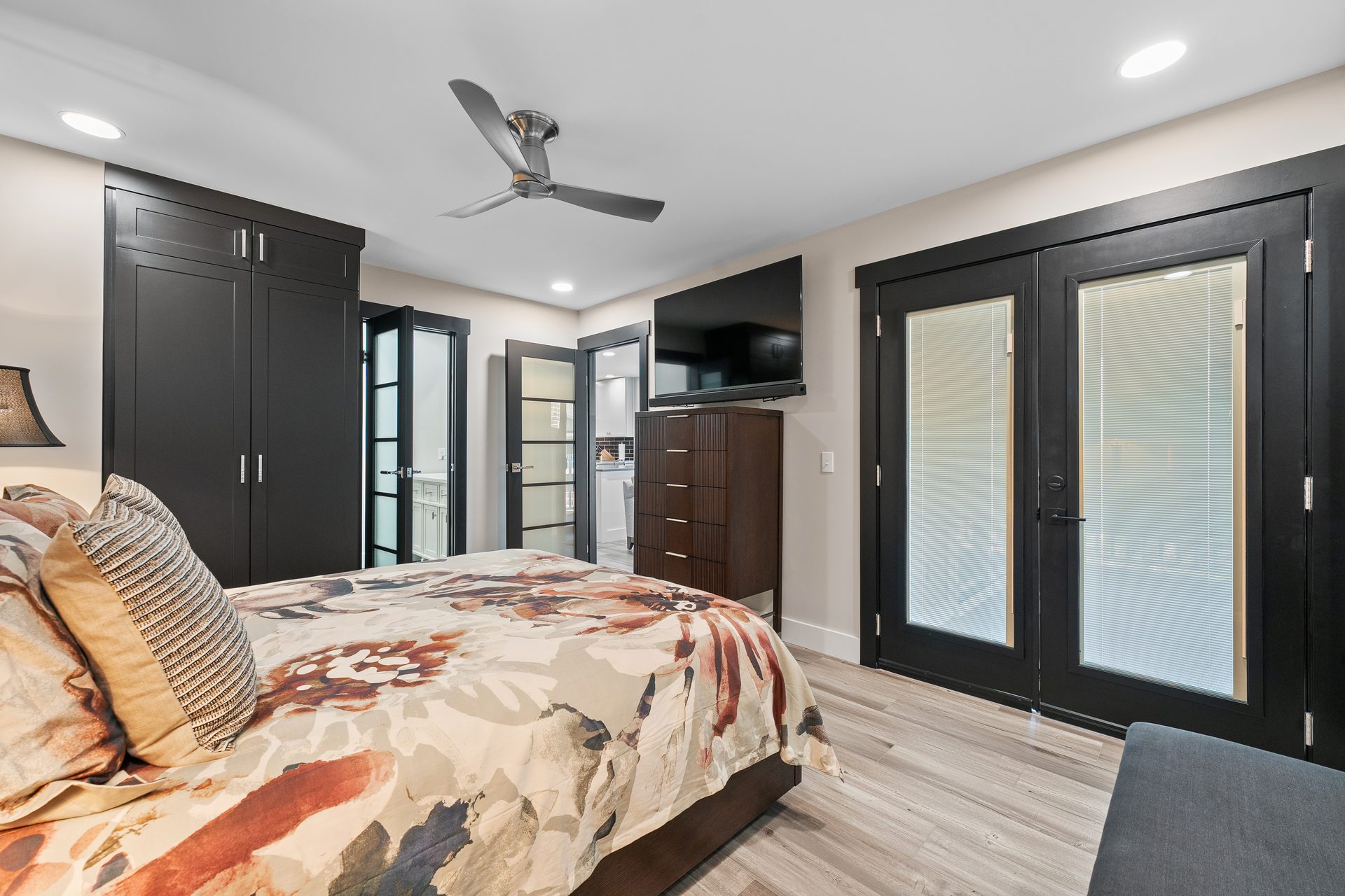 Renovated bedroom with built-in wardrobe, new trim and french doors